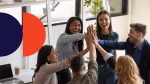 Office team celebrating with a high five
